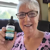 Customer Deborah S. holding Pineal Guardian Advanced