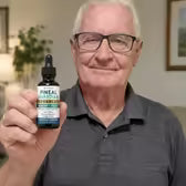Customer George W. holding Pineal Guardian Advanced