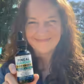 Customer Michelle K. holding Pineal Guardian Advanced