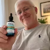 Customer Paul E. holding Pineal Guardian Advanced