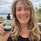 Customer Tracy L. holding Pineal Guardian Advanced