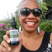 Customer Yvonne P. holding Pineal Guardian Advanced